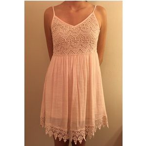Cream colored lacy dress.